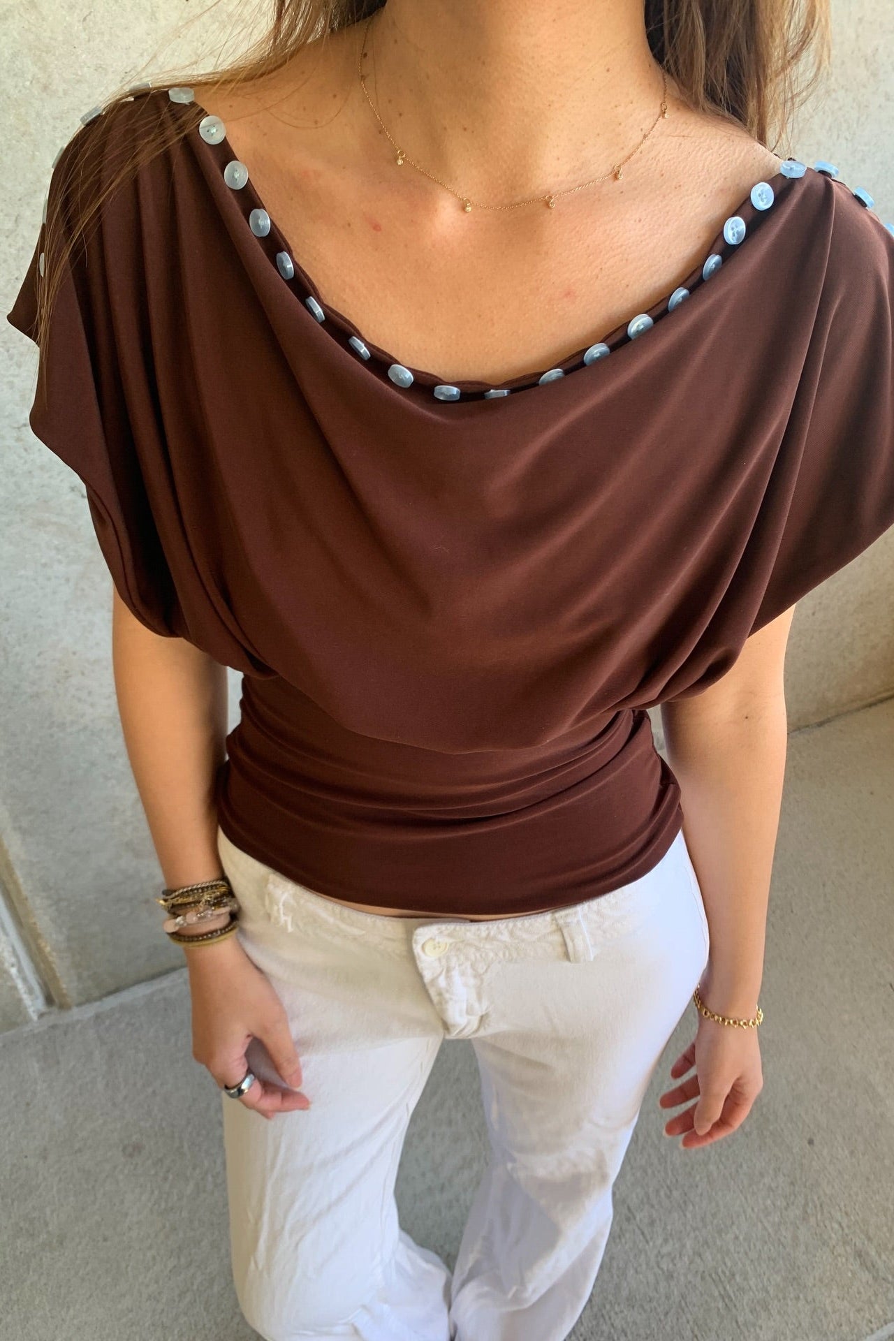 Brown draped convertible top with fitted waist, side view