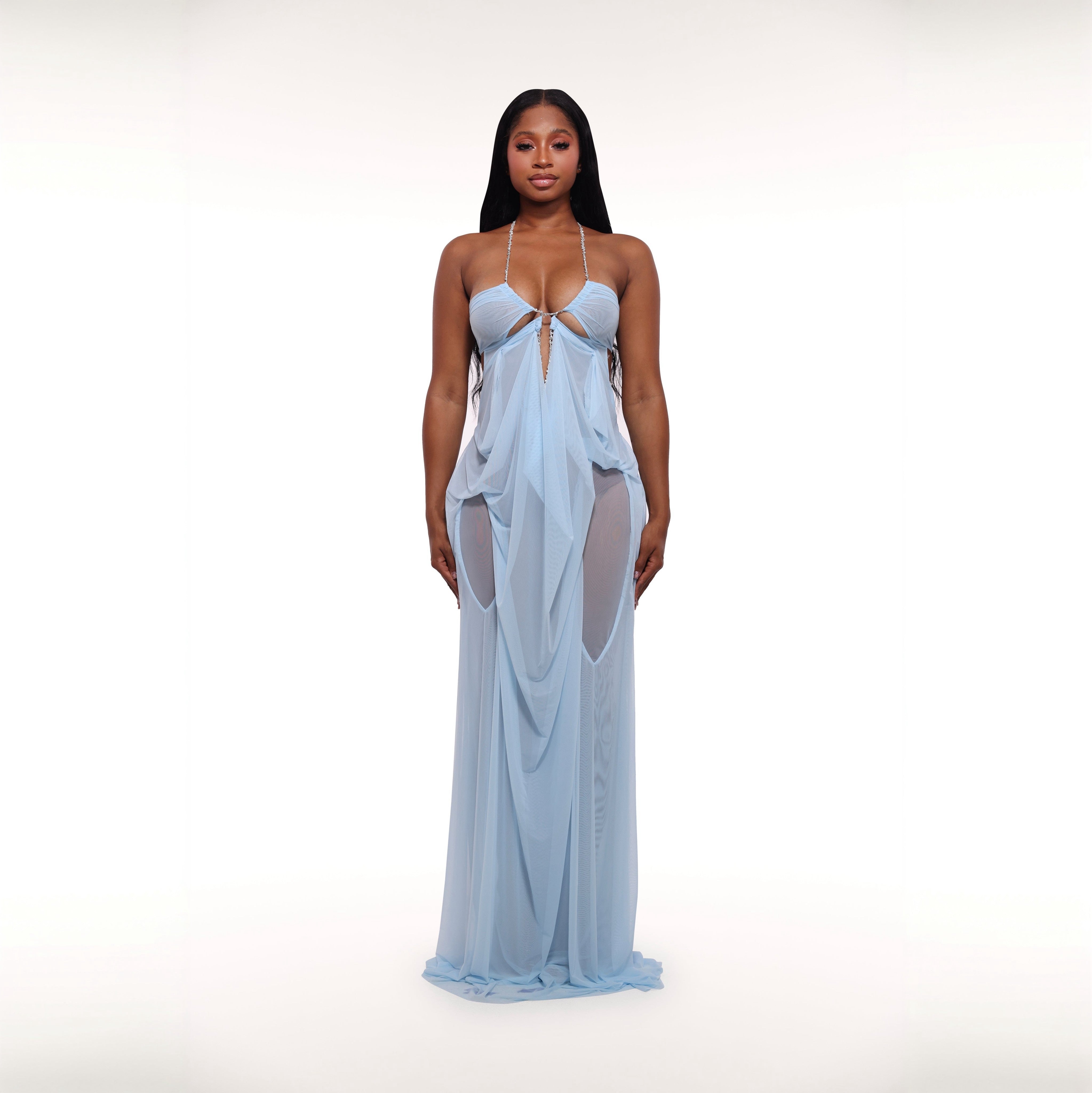 Woman wearing a light blue evening gown on a white background