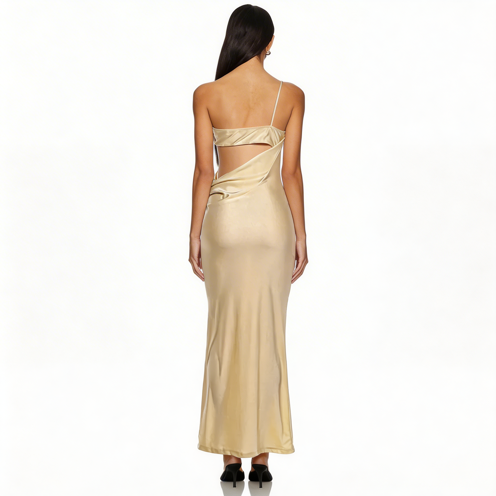 Woman wearing a gold evening gown with a white background