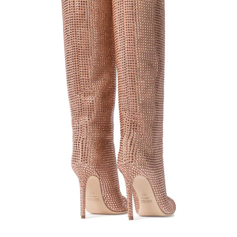 Rose gold studded knee-high boots on a white background