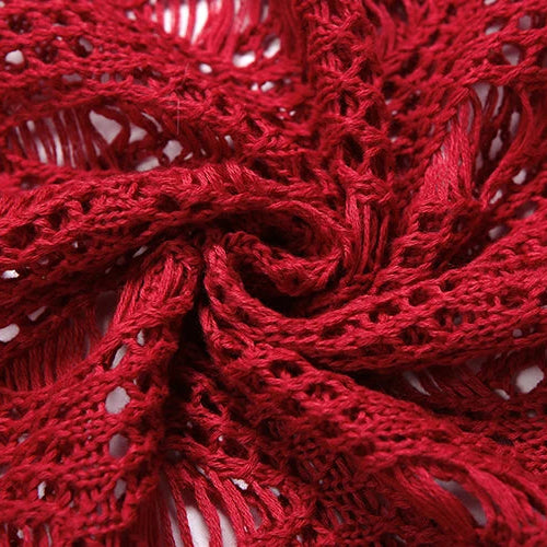 Close-up of red lace fabric with intricate patterns