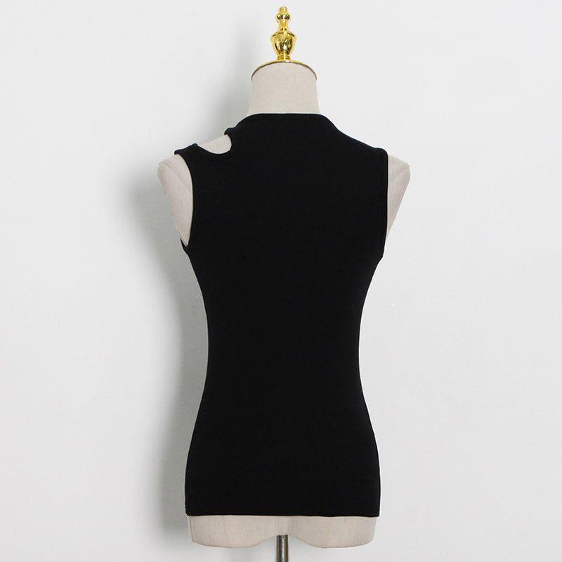 Black sleeveless top on a mannequin against a white background