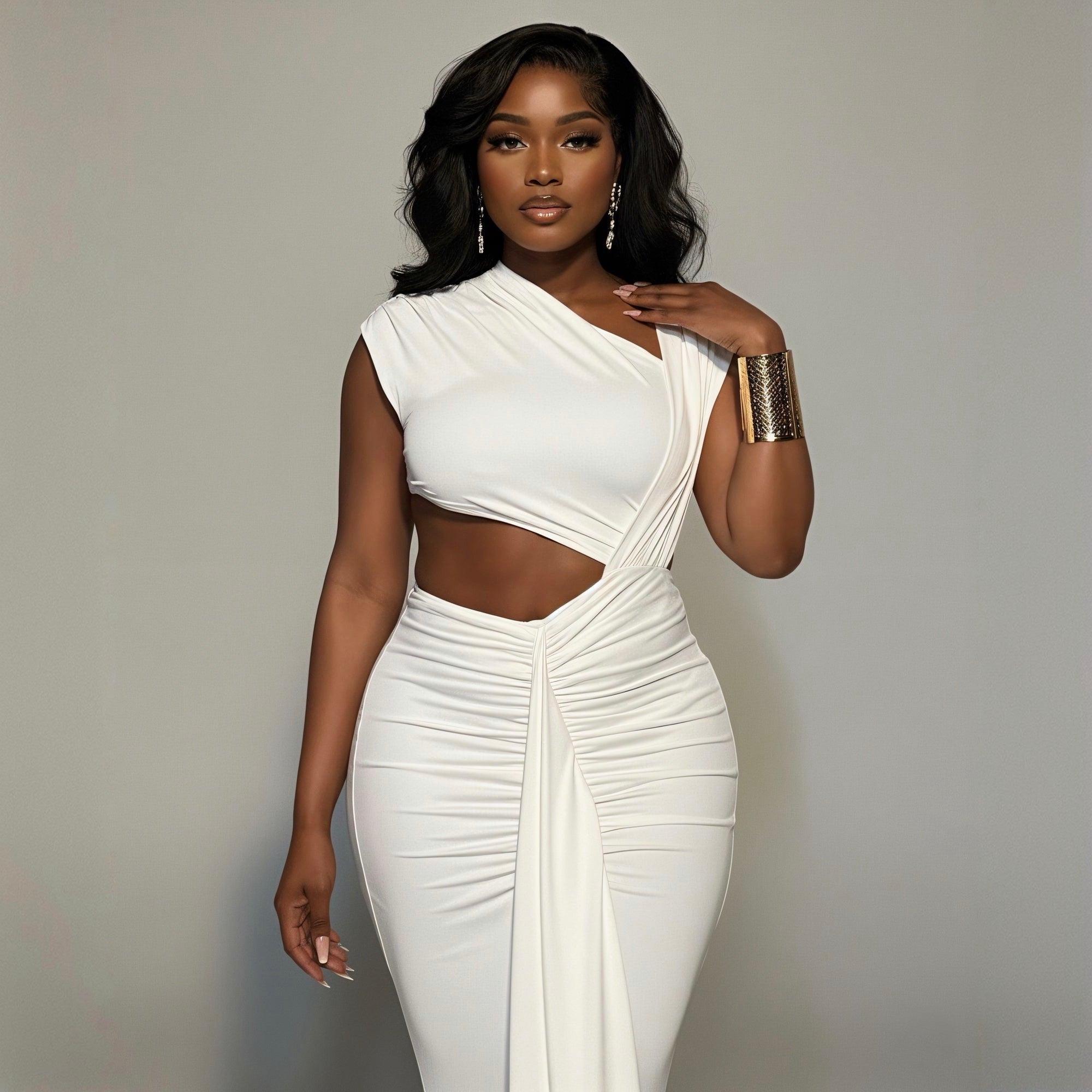 Woman wearing a white dress with a cutout design on a plain background