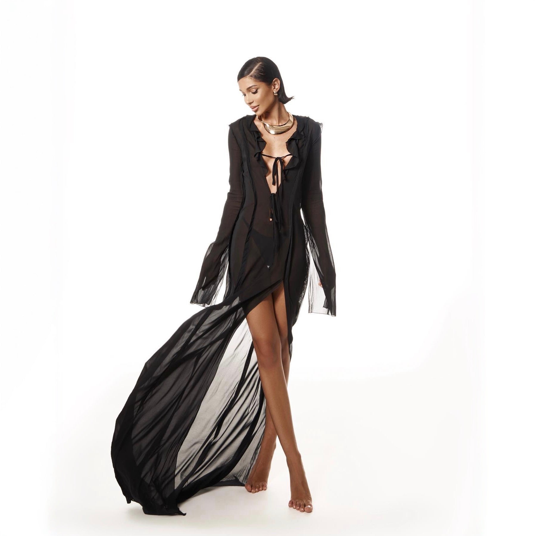 Woman wearing a black and white dress on a white background