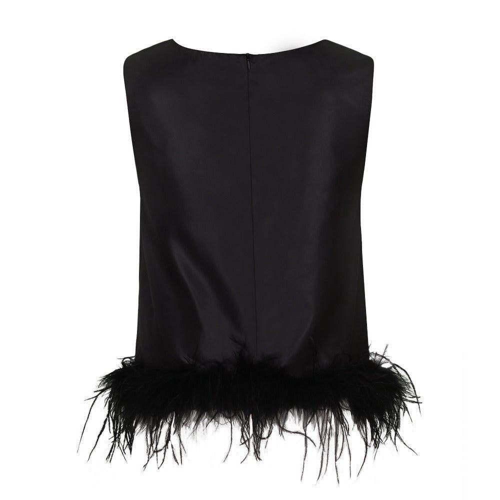 Black sleeveless top with feather details on a white background