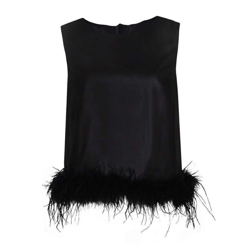 Black sleeveless top with feather details on a white background