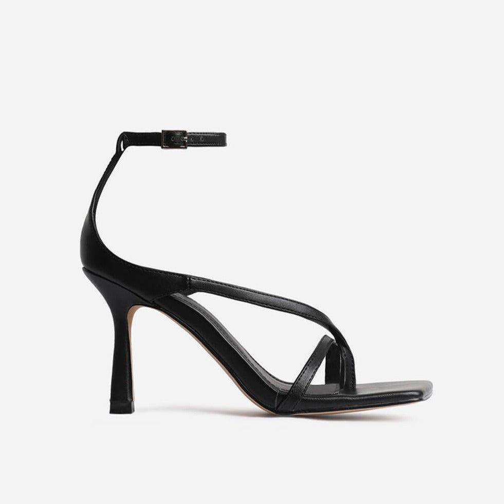 Black high-heeled sandal on a white background