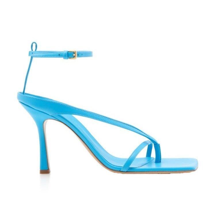 Blue high-heeled sandal on a white background
