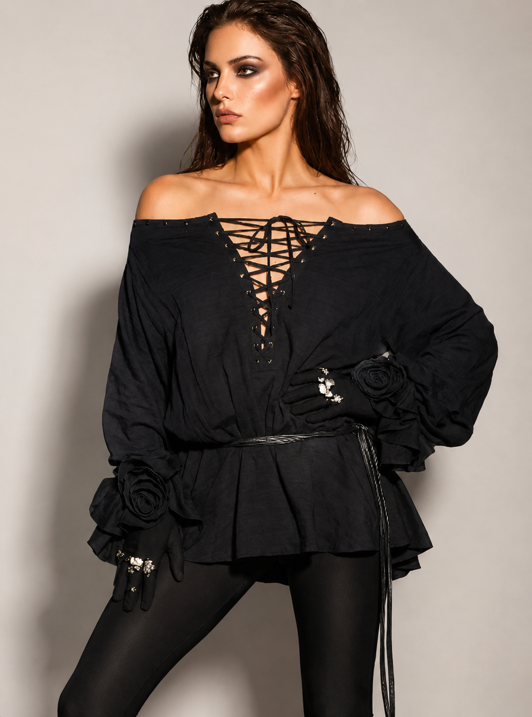 a black off-shoulder top with intricate detailing