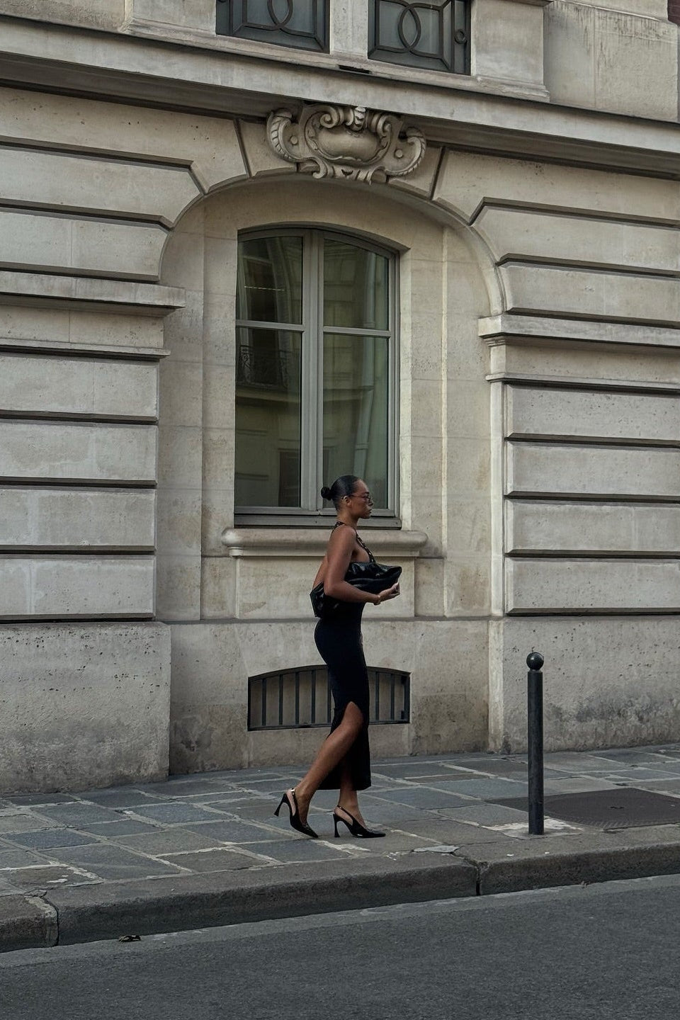 Virelle black midi dress with side slit, full-length editorial shot