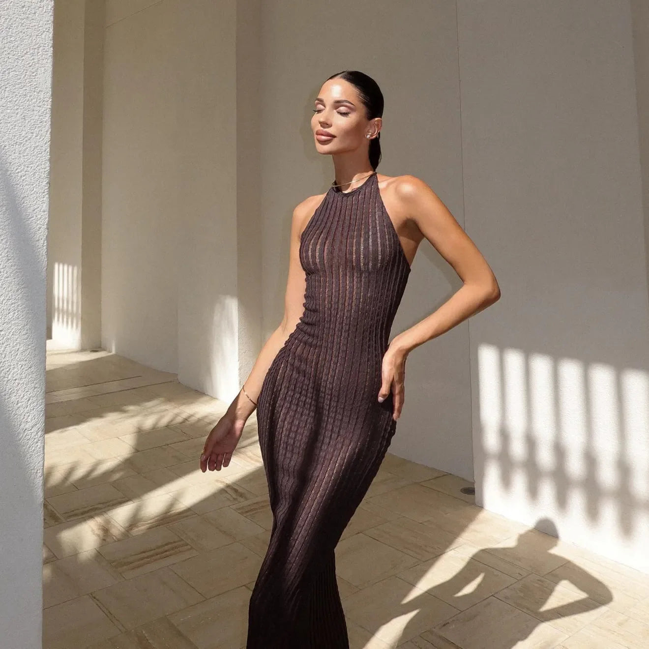 Sheer halter maxi dress for an elegant evening look.