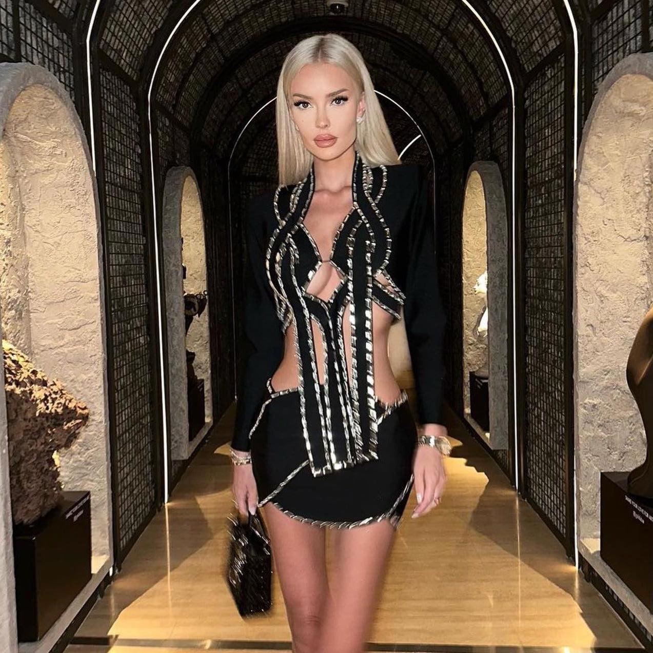 Cut-out black mini dress with silver accents, perfect for a night-out style.