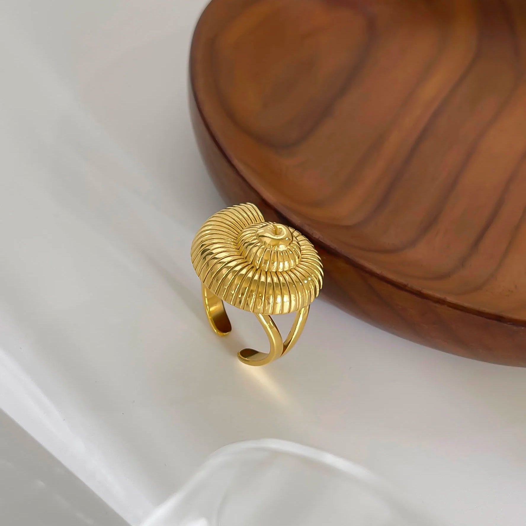 Gold seashell-inspired statement ring.