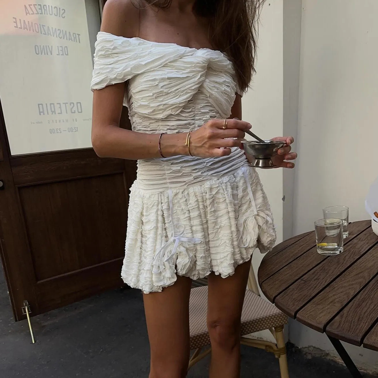 Ruffled off-shoulder mini dress, casual day-out style.