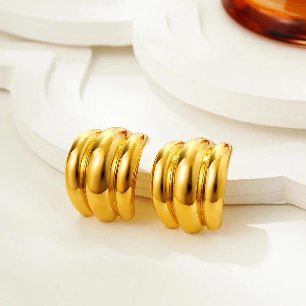 Gold layered hoop earrings for evening wear.