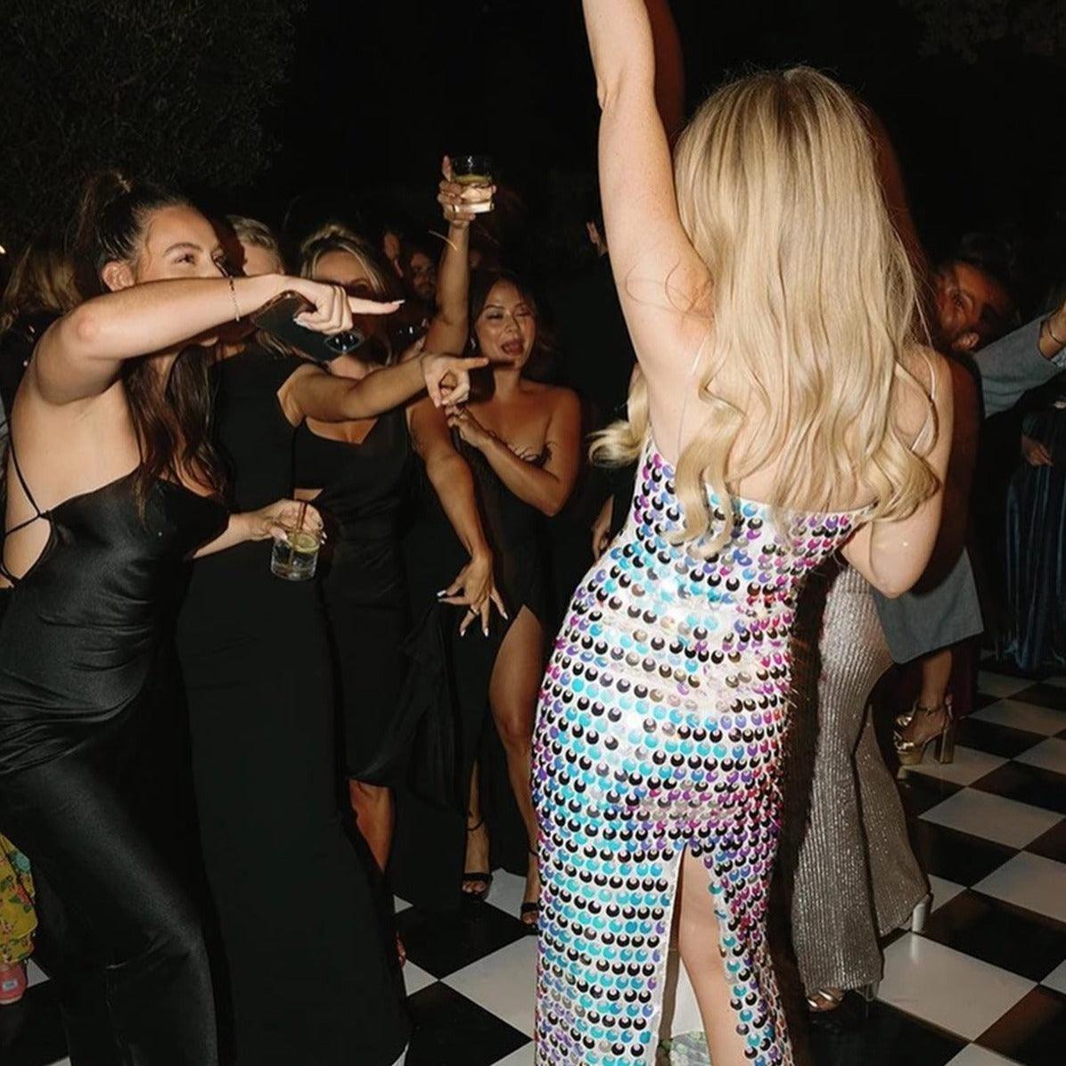 Sequin party dress with a high slit.