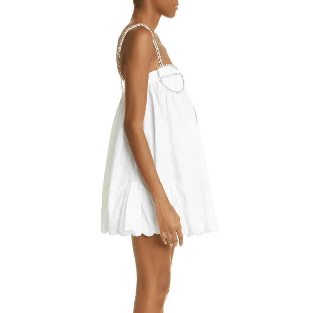 White mini dress with scallop hem and crystal-embellished straps, summer party outfit