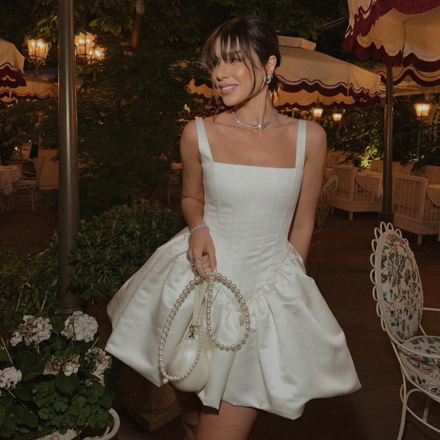 White satin mini dress with structured silhouette, elegant evening look