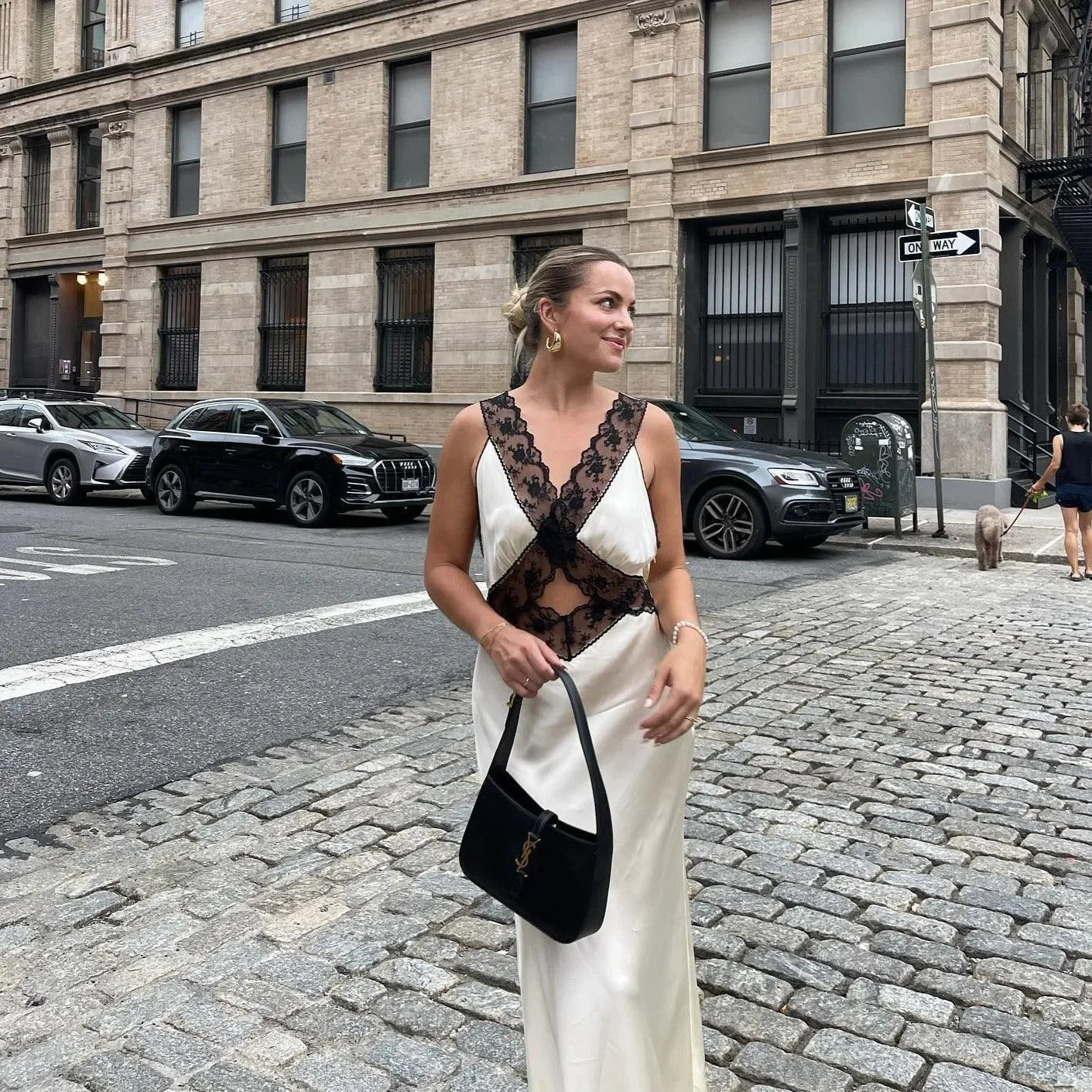 Lace and satin dress with sheer paneling, chic evening attire.