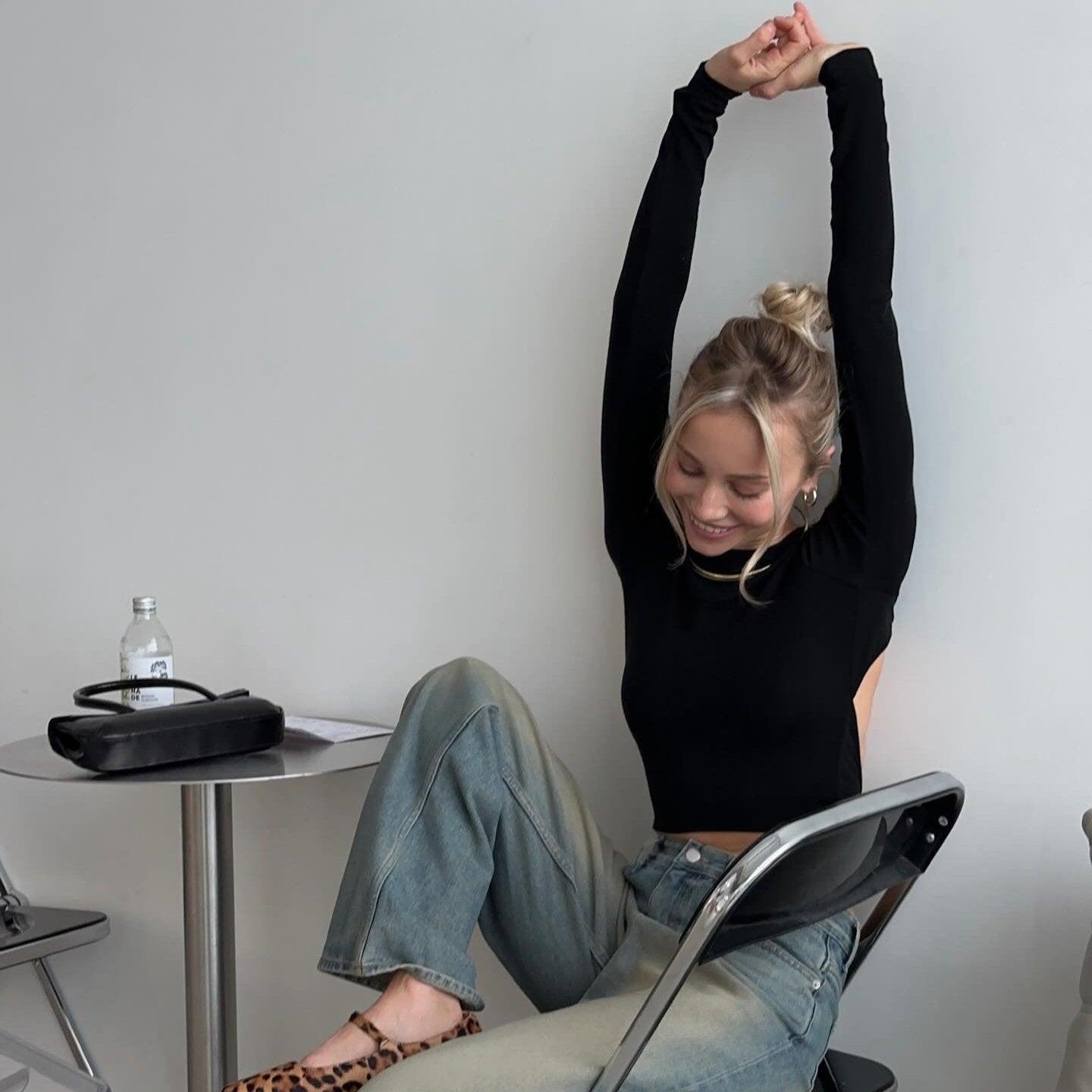 black open-back long-sleeve top, casual style