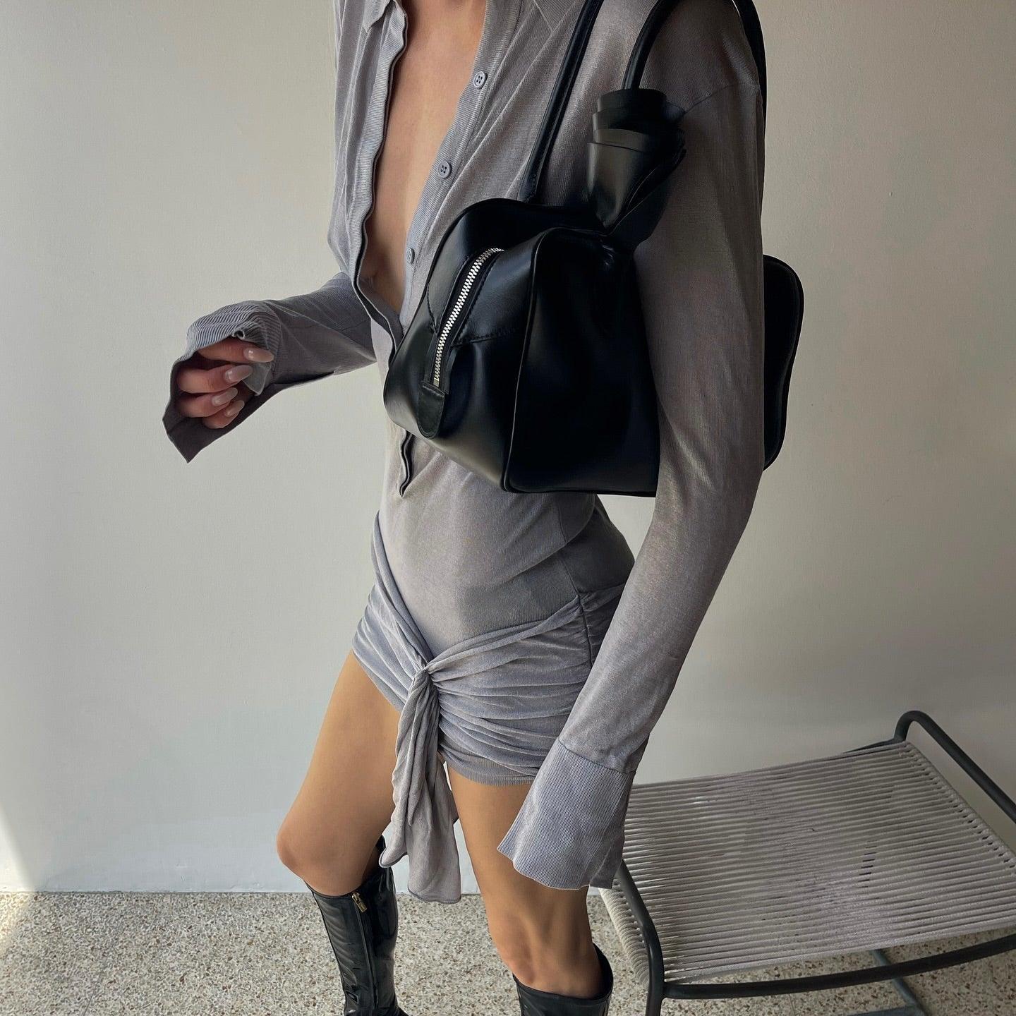 Long-sleeve ruched mini dress with front knot detail, casual chic style.