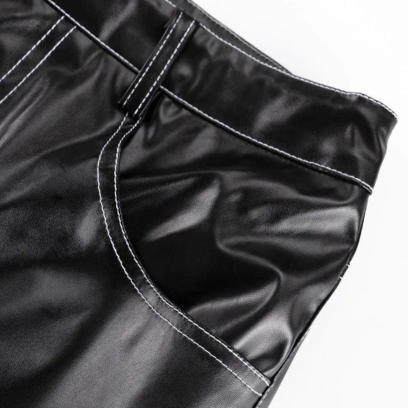Black leather mini skirt with white stitching.