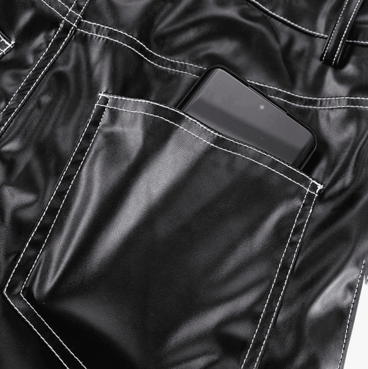 Black faux leather pants with contrast stitching, casual chic style