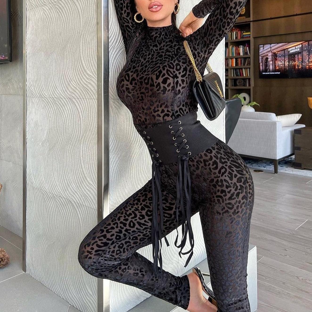 Leopard print mesh jumpsuit with corset belt, chic evening look.
