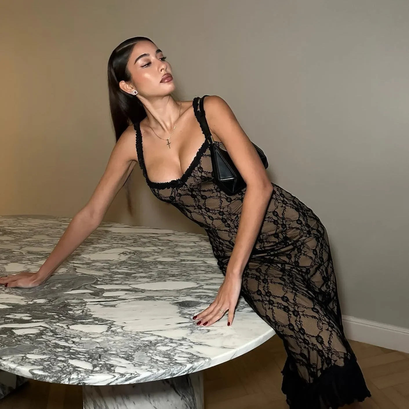 Black lace bodycon dress with scalloped edges, elegant evening wear.