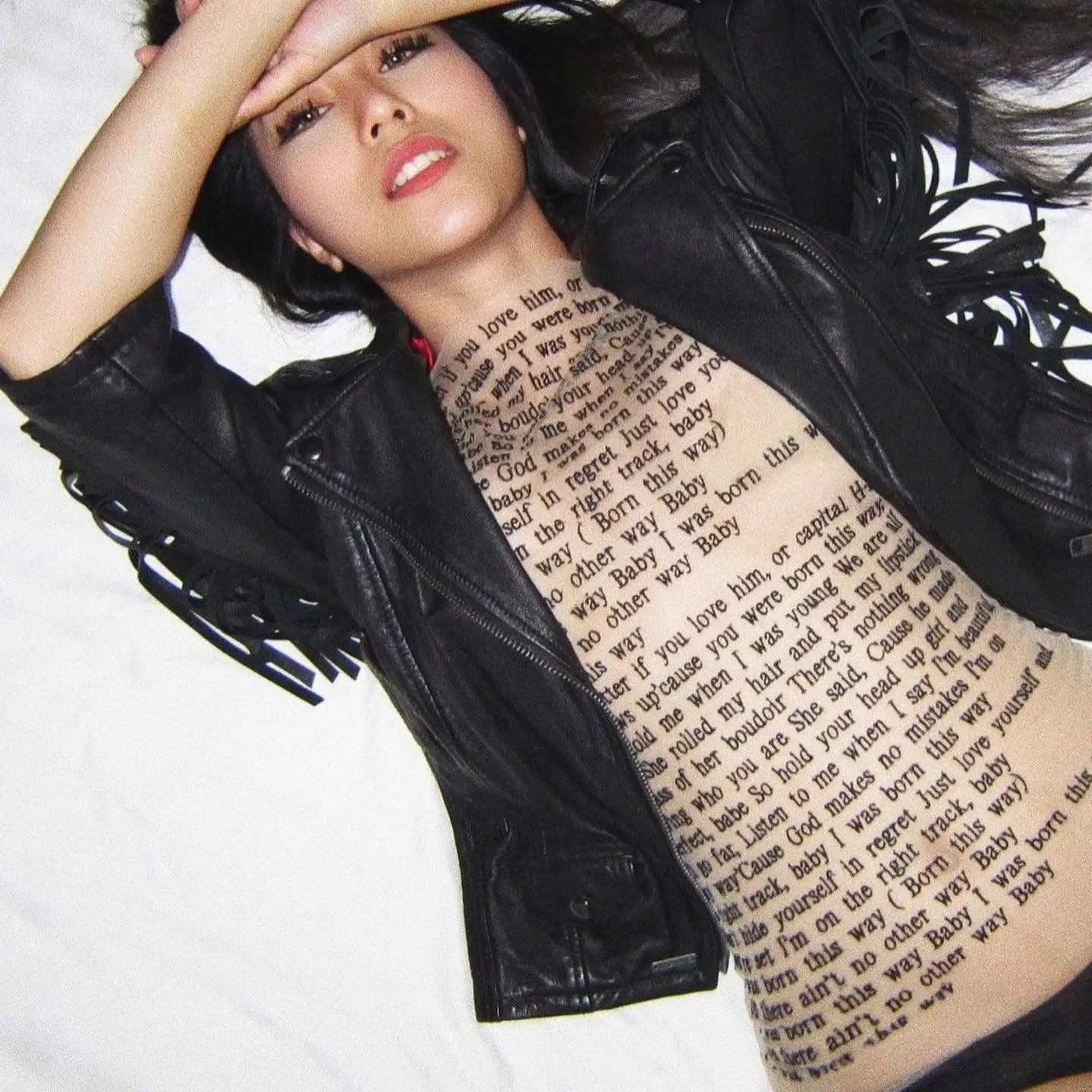 Text-print mesh bodysuit with black leather jacket, edgy and trendy style