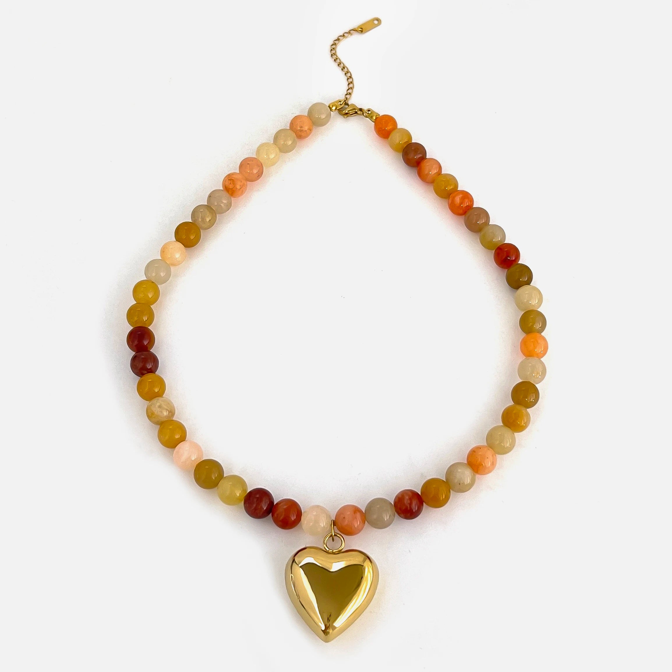 Beaded necklace with colorful stones and gold heart pendant, chic accessory.