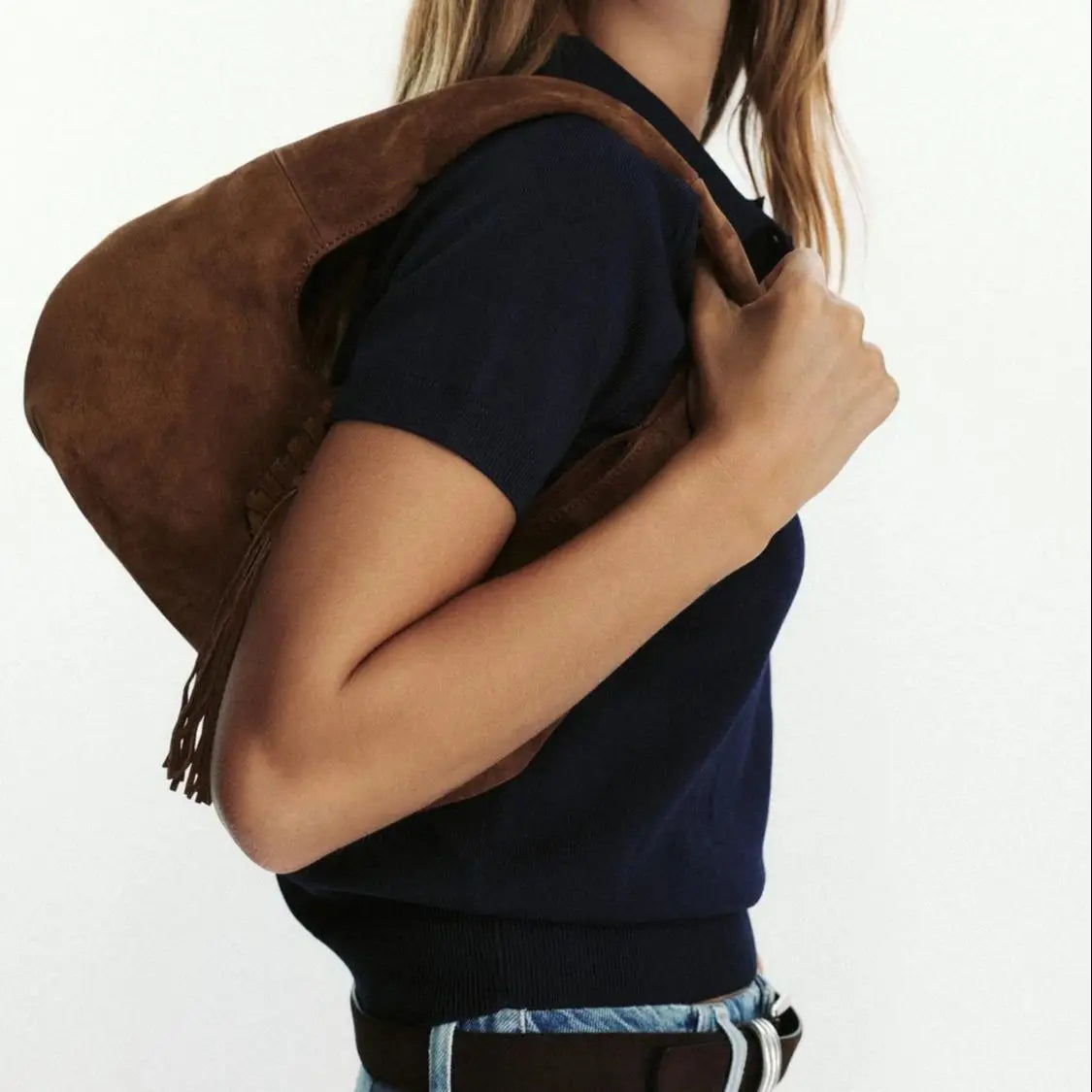Brown suede handbag with fringe detail, casual accessory style