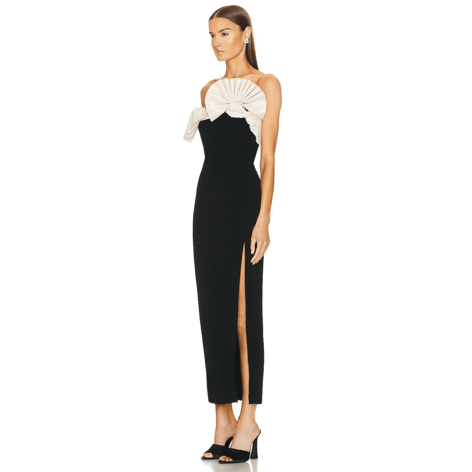 Black strapless dress with white bow and high slit.