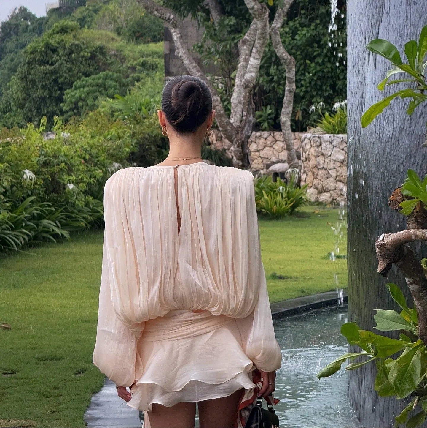 Chiffon mini dress with long sleeves and layered details, elegant daywear.