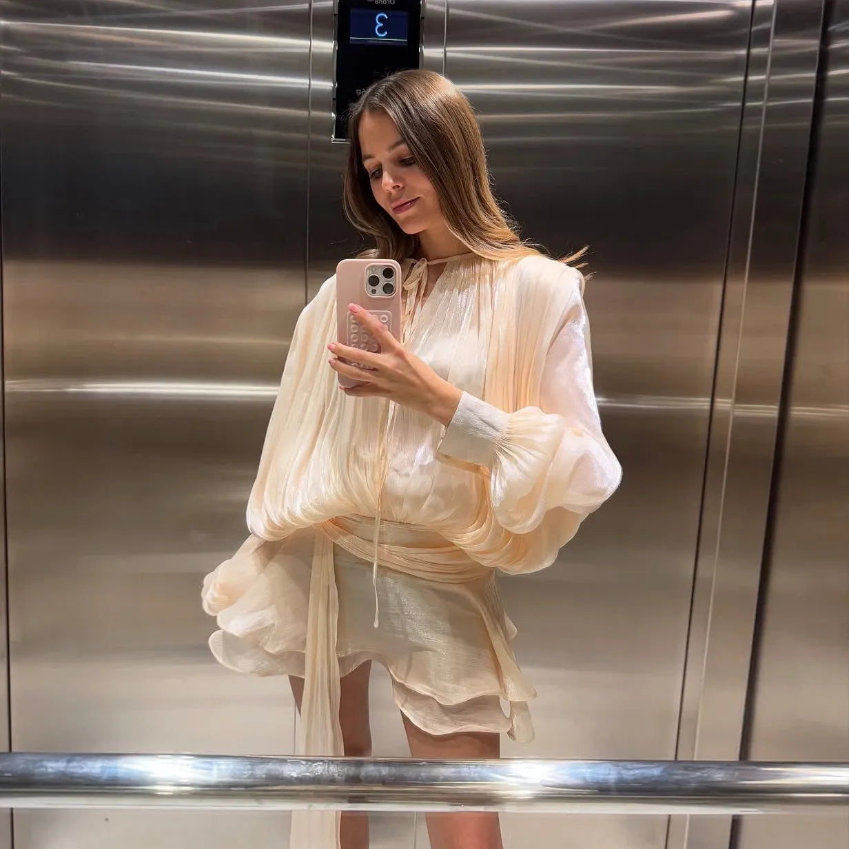 Flowy chiffon mini dress with layered ruffles, elegant evening outfit.