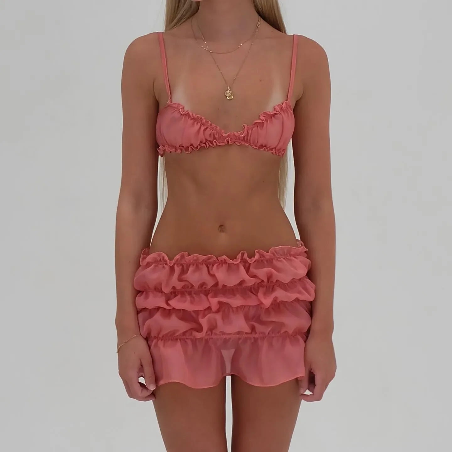 Two-piece ruffled mesh bralette and mini skirt set, playful party outfit