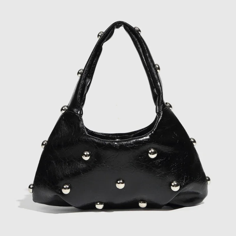 Black shoulder bag with silver stud embellishments, edgy accessory for night-out styling