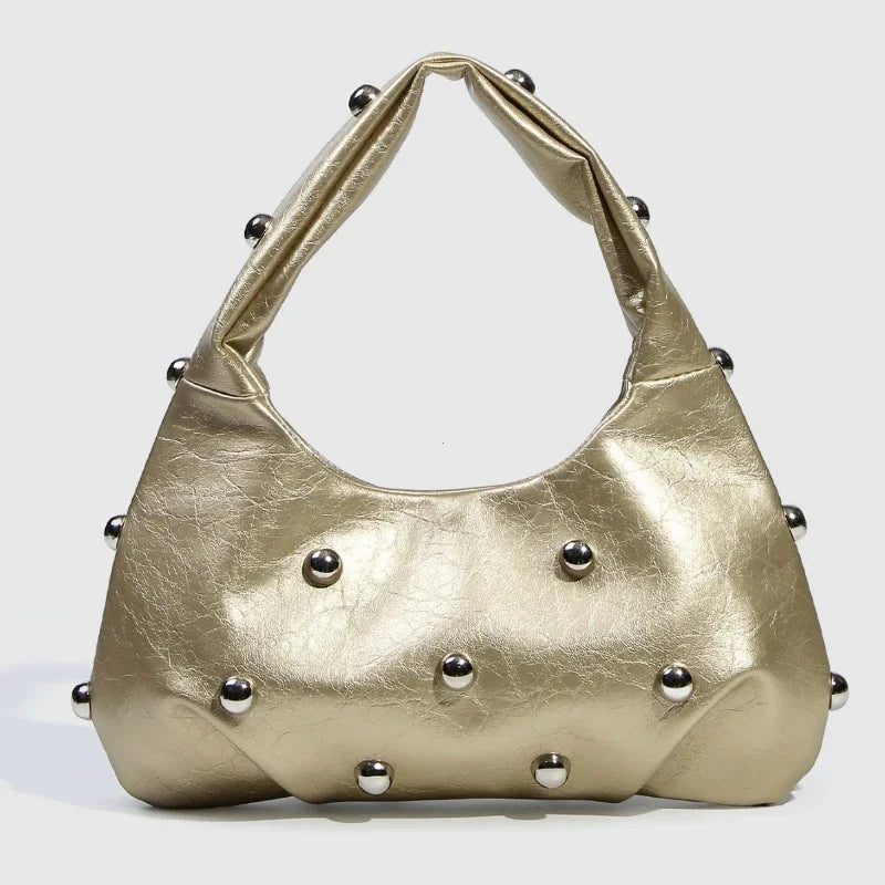 Gold metallic handbag with stud embellishments, statement accessory