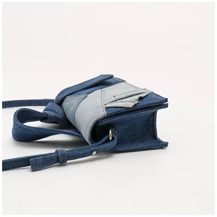 Denim patchwork crossbody bag with adjustable strap, casual accessory.