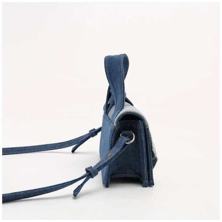 Denim crossbody bag with adjustable strap, casual accessory.