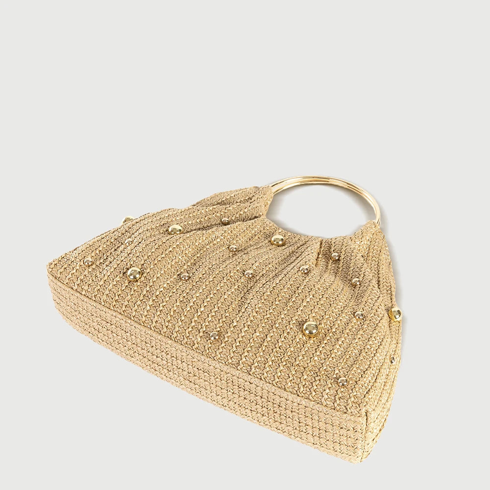 Straw handbag with gold embellishments and metal ring handles, chic accessory for summer outings.