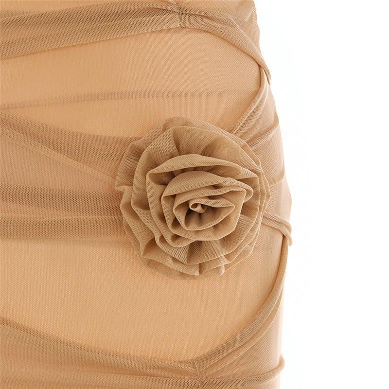 Ruched mesh dress with floral appliqué, elegant evening wear.