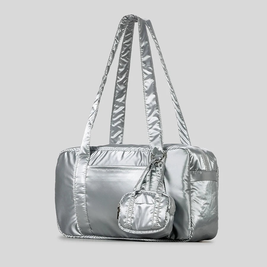 Silver satin duffle bag with matching mini pouch.