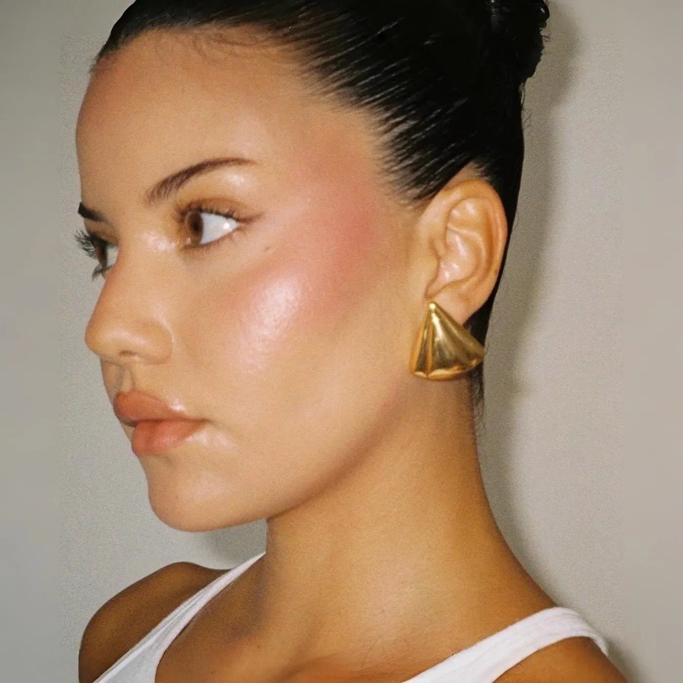 Gold geometric statement earrings, bold accessory piece