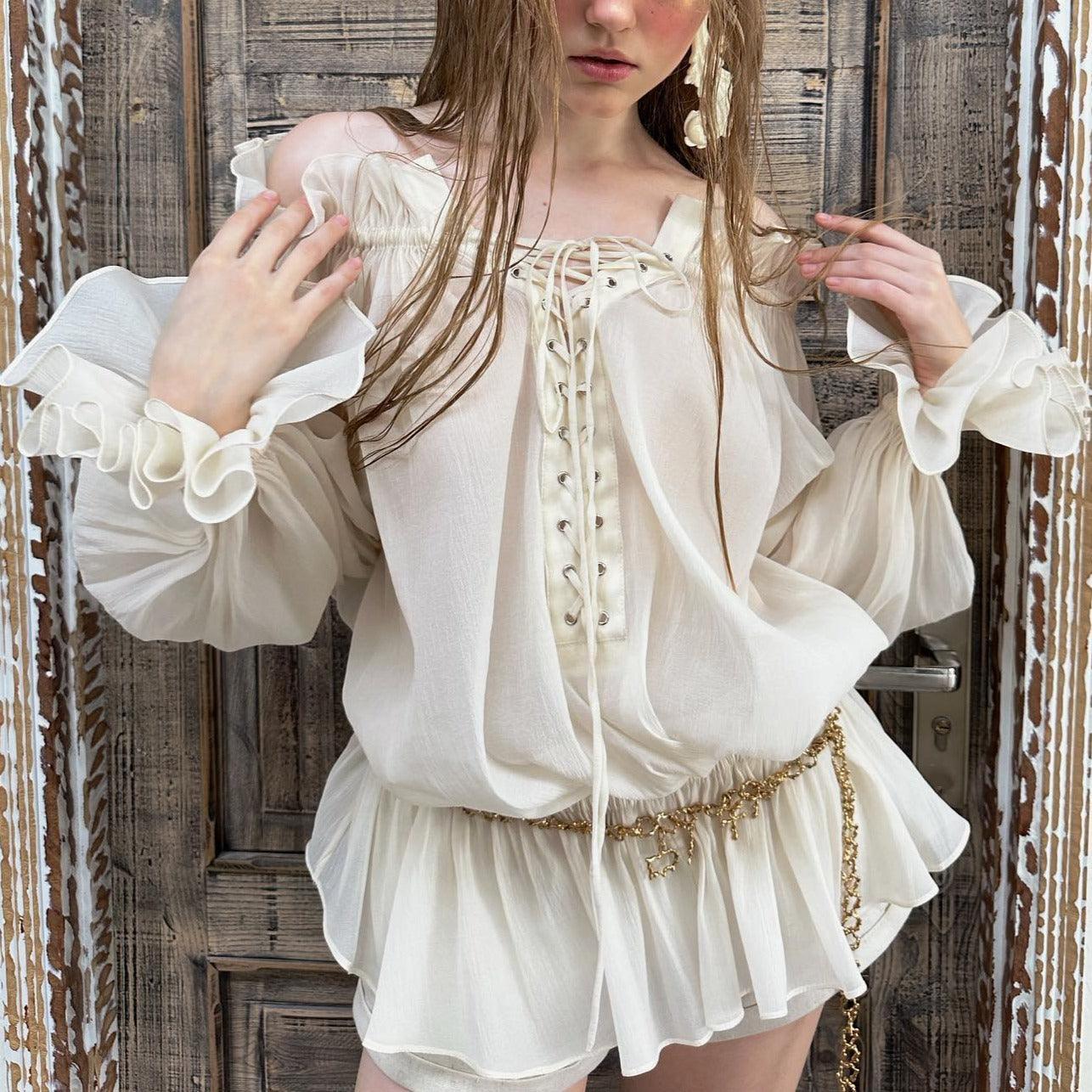 ruffled lace-up off-shoulder blouse with gold chain belt, casual chic look
