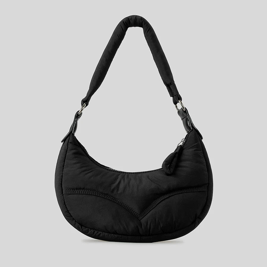 Black padded shoulder bag, casual accessory.