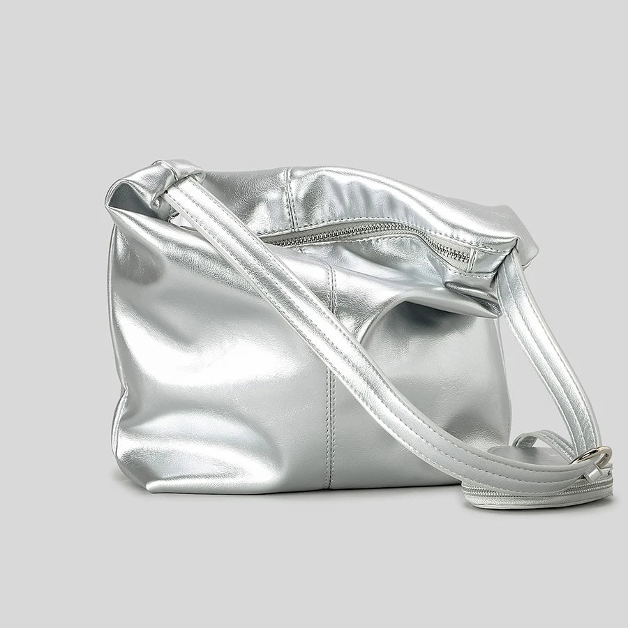 Silver metallic shoulder bag with zip closure, stylish accessory for night-out look