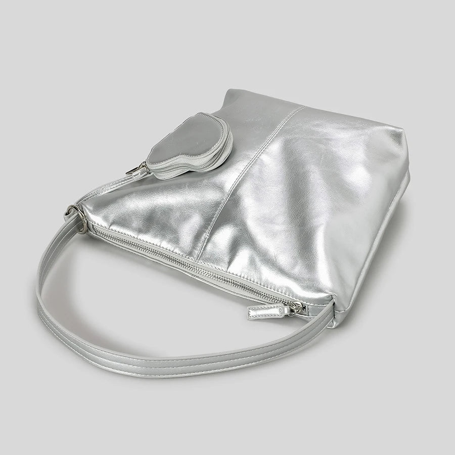 Silver metallic shoulder bag with a matching coin pouch attachment.