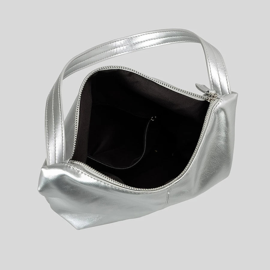 Silver metallic shoulder bag with zip closure.