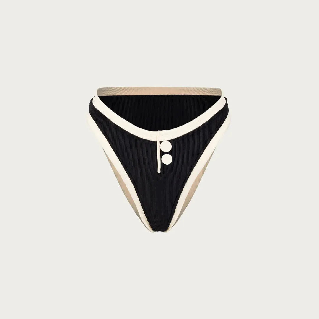 Two-tone high-waisted bikini bottom with button details.